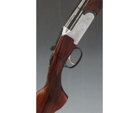 Lincoln No 2 20 bore over and under shotgun with engraved scenes of dogs and birds to the locks, engraved underside, trigger 