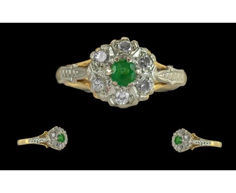 18ct Gold Ladies Attractive Emerald and Diamond Set Cluster Ring. Full Hallmark to Interior of Shank. The Central Emerald of 