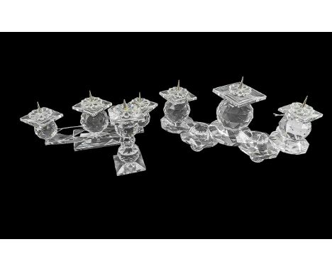 Set of Swarovski Candlesticks, comprising a three branch 4'' high 2 9'' wide, one three branch measuring 3'' x 8'', and a sin