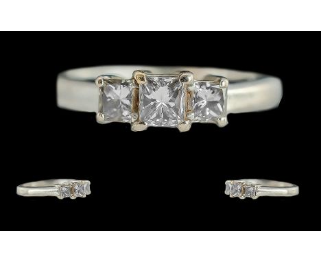 Ladies 18ct White Gold Contemporary Three Stone Diamond Set Ring, full hallmark to interior of shank.  The three princess cut