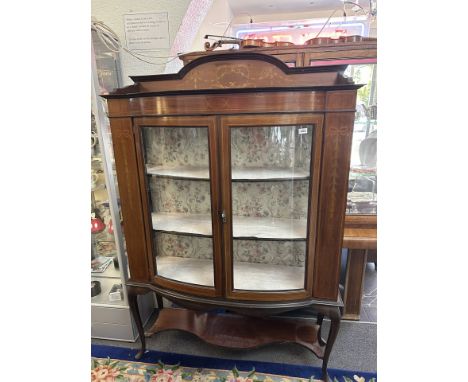 Display Cabinet/Tall Boy, glass bow front with three interior shelves, decorative inlaid banding and pattern, raised on four 