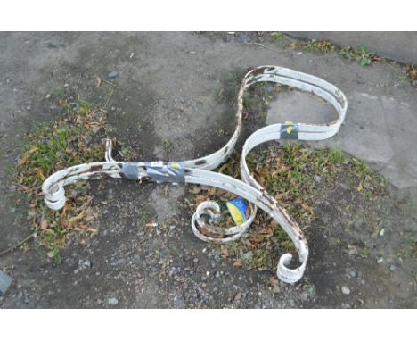 A pair of metal bench ends
