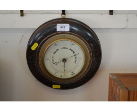 An oak cased barometer 