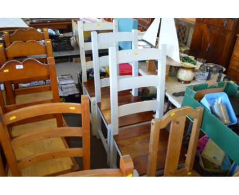 A set of three painted ladder back dining chairs