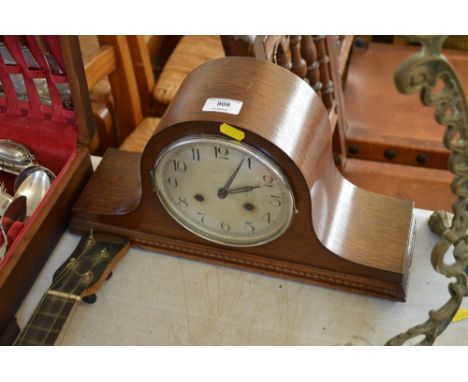 An oak cased two hole mantle clock 