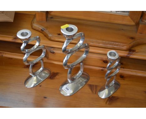 Three candlestick holders 