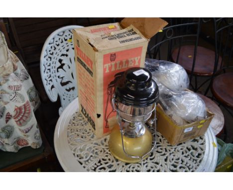 A boxed tilley lamp