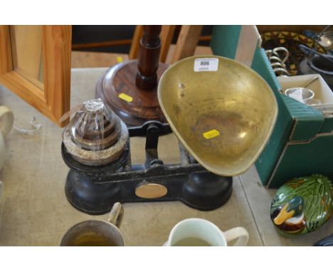 A set of kitchen scales and weights