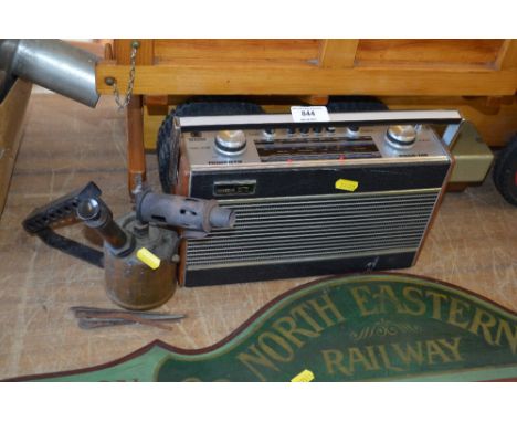 A Roberts radio together with a brass blow lamp