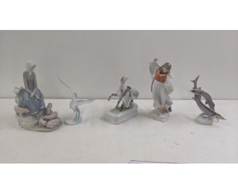 A group of porcelain figures to include two Herend examples dancing figure no 5496 and man with horse no 5588 together with L