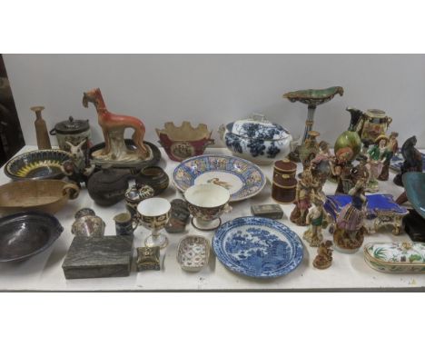 A mixed lot of ceramics to include a selection of figures, a Majolica rams head candleholder, late 19th century/early 20th ce