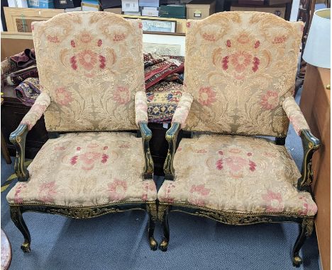 A pair of reproduction French Louis XV style armchairs having scroll gilt highlights and floral tapestry upholsteryLocation: 