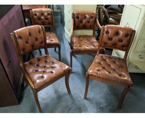 A set of four Reprodux button brown leather dining chairs, one being a carver Location:If there is no condition report shown,