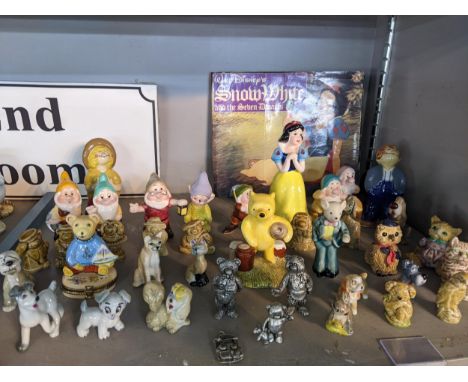 A collection of miniature ceramic figures to include Royal Doulton 'Poof counting the honeypots', a collection of Walt Disney