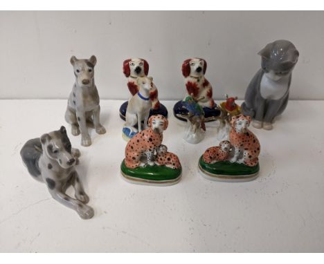 A group of ceramic animal figures to include a pair of 18th century Continental dalmatians, a Danish model of a cat, a pair o