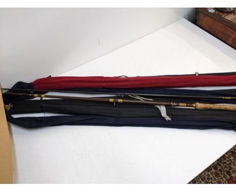 A collection of fishing rods to include a Hardy's example and others, together with a silver plated angling hip flaskLocation