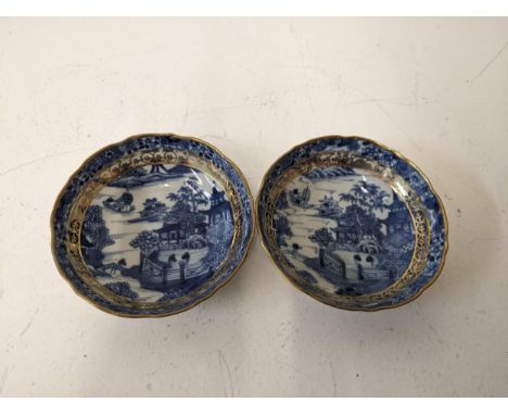 Two late 18tch century Chinese blue and white saucers with a gilt border and edge.Location: 1-3If there is no condition repor