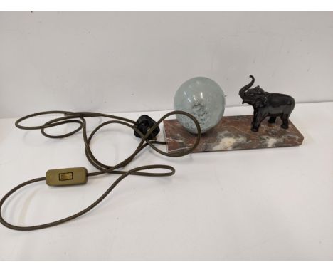 An Art Deco French spelter lamp with an elephant and glass shade, on a marble plinthLocation:If there is no condition report 