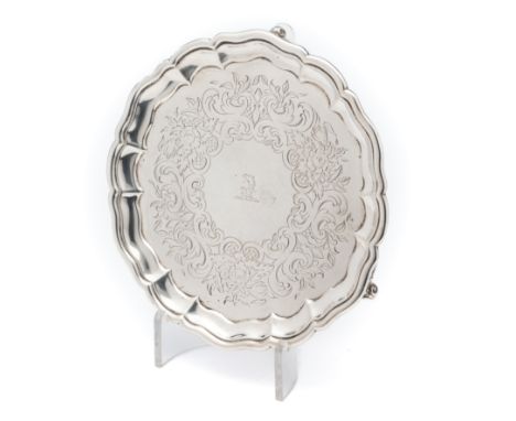 A VICTORIAN SILVER WAITER, GEORGE IVORY, LONDON, 1849 shaped circular, engraved with a crest surrounded by a scroll foliate a