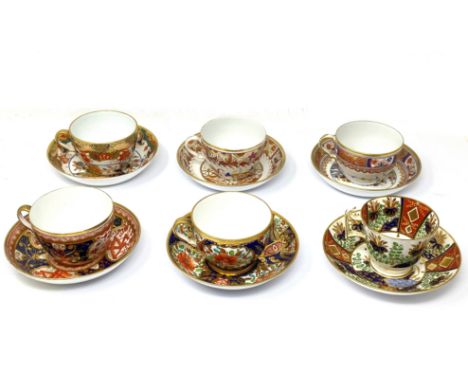 A GROUP OF SIX SPODE TEA AND COFFEE CUPS AND SAUCERS, EARLY 19TH CENTURY of London or Bute shape and painted with various pat