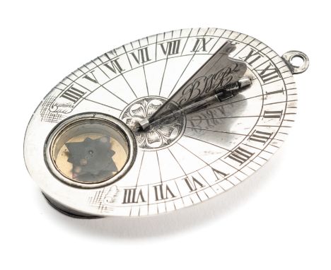 A SILVER BUTTERFIELD TYPE DIAL, PROBABLY FRENCH 18TH CENTURY the oval plate housing a compass-rose-shaped needle, the chapter