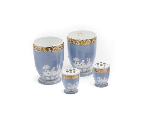 A PAIR OF SPODE VASES, CIRCA 1815 the U-shaped bodies with white relief putti against a lilac ground beneath a gilt foliate b