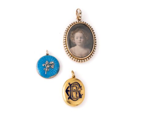 ˜COLLECTION OF THREE LOCKETS, LATE 19TH CENTURY comprising: oval bloomed gold locket with blue enamel monogram 'EBR' and 'Ann