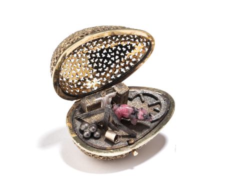 A SILVER-GILT SURPRISE EGG, STUART DEVLIN, LONDON, 1977 the openwork 'filigree' body hinging via a pushpiece to reveal a farm