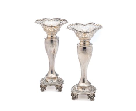 A PAIR OF GEORGE V SILVER VASES, THE ALEXANDER CLARK CO. LTD., BIRMINGHAM, 1912 with everted necks of foliate trellis piercin