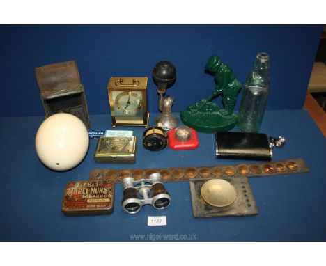 A quantity of miscellanea including an Ostrich egg, quartz clock, lamp, car horn, green doorstop, etc.