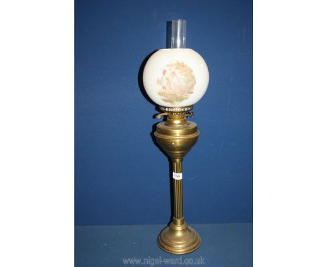 An Oil Lamp with reeded brass base, white glass shade decorated with game birds and clear glass chimney, 29'' tall.