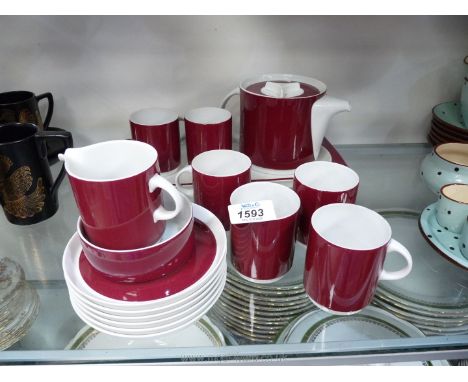 A Thomas, Germany teaset in burgundy and white including six cups and saucers, teapot, milk jug, sugar basin and tray.