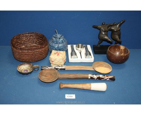 A pair of wooden salad servers with bone handles, sculpture of two ladies, metal wine tasting cup, cruet set etc.