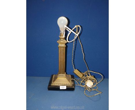 A Brass column table Lamp on black base, 17'' tall.