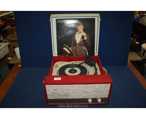 A Dansette Viva record player in red and cream case.