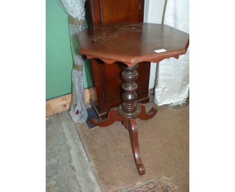 A mixed woods octagonal occasional Table standing on a turned pillar and three splay feet, 20 1/4'' diameter x 28 1/4'' high.