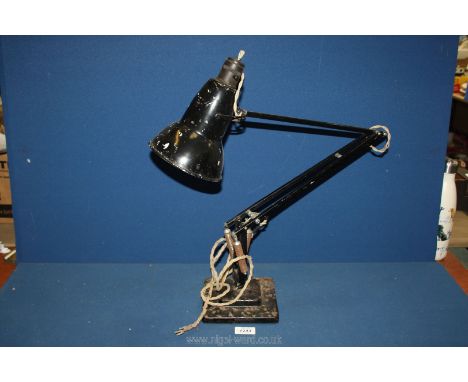 A black angle poise lamp (some wear/rusting).