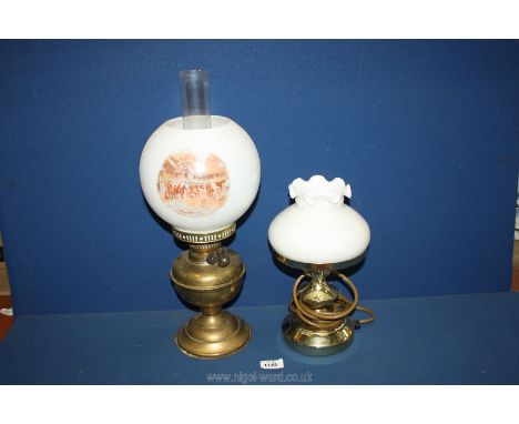 An Oil Lamp with brass base, white glass shade decorated with hunting scenes and clear chimney, 18'' tall together with a mod