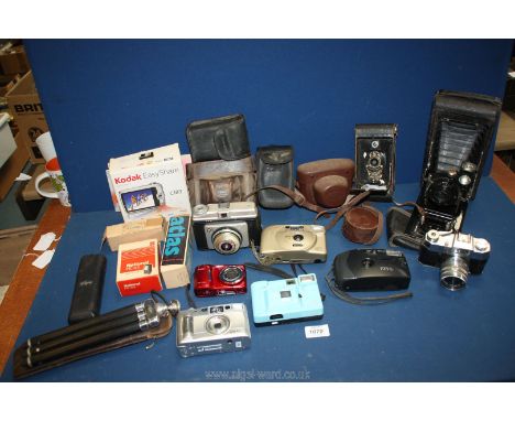 A quantity of cameras including a Houghton Butcher Ltd. Ensign camera with Trichro shutter, cased Fujifilm zoom 70v film came