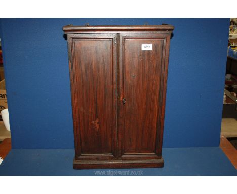 A darkwood table top Cabinet/Wall unit fitted with hooks and shelf possibly for medicine, with key, 22 1/2" x 15" x 6".