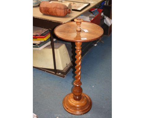 A mid 19th c. Walnut reading Table having a round curved step base, spiral column, circular top inset candle sconce, label un