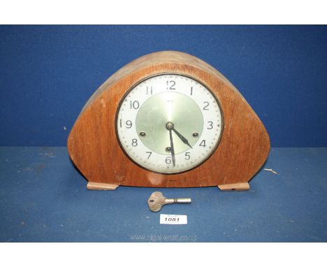 A Smiths Westminster chiming Mantle clock, with key, 8 1/2" tall.