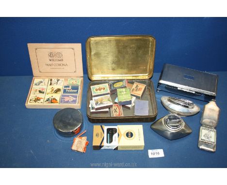 A small quantity of smokers ephemera including lighters, match stick holder, matches, etc.