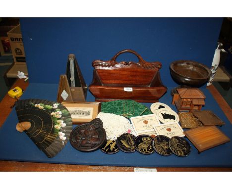A box of miscellaneous wooden items including Metronome, wooden bowl, trough, etc.