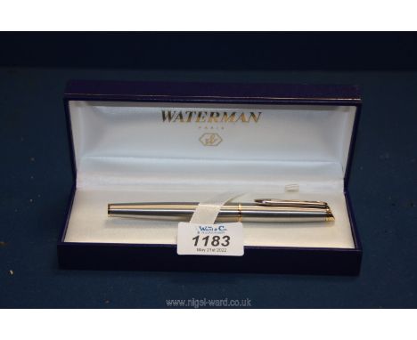 A silver and gold coloured Waterman fountain pen, boxed.