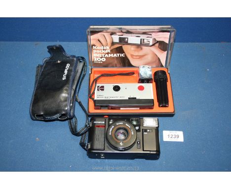 An Olympus Zuiko 38 mm  camera with f/1:2.8 lens, in leather case and a Kodak pocket Instamatic 200 camera including film and