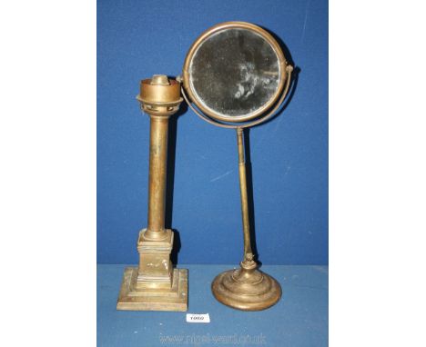 A brass column lamp stand 15" tall and a brass dressing table double sided mirror 18 1/2" tall, one side magnified x 3.