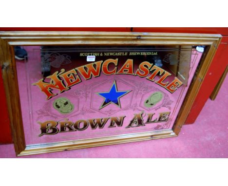 A 'Newcastle Brown Ale' pine framed advertising mirror