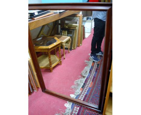 A modern faux mahogany framed wall mirror, h.128cm
