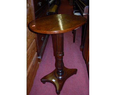 A mahogany oval fixed top pedestal tripod occasional table, together with an Edwardian walnut octagonal top two-tier occasion